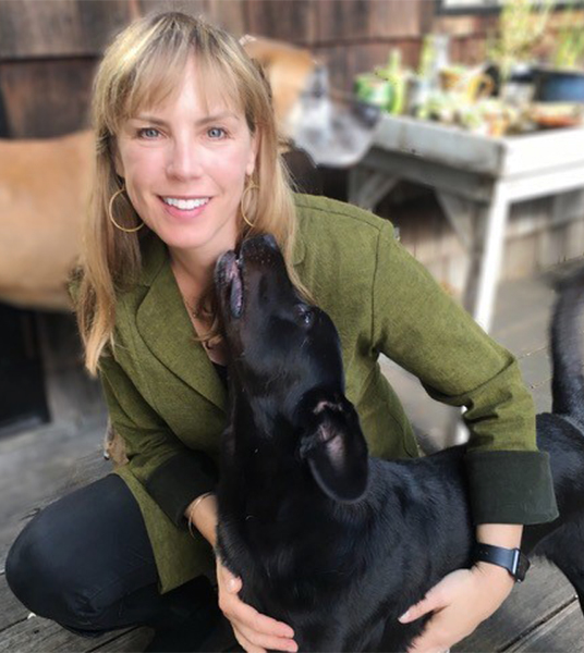Anne Carlson, founder and CEO of Jiminy's, with her dog Tuco