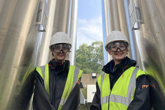From left: Iseabail Farquhar and Charlotte Lee, Ph.D. interns with MiAlgae, at the company’s production site in Balfron, Scotland