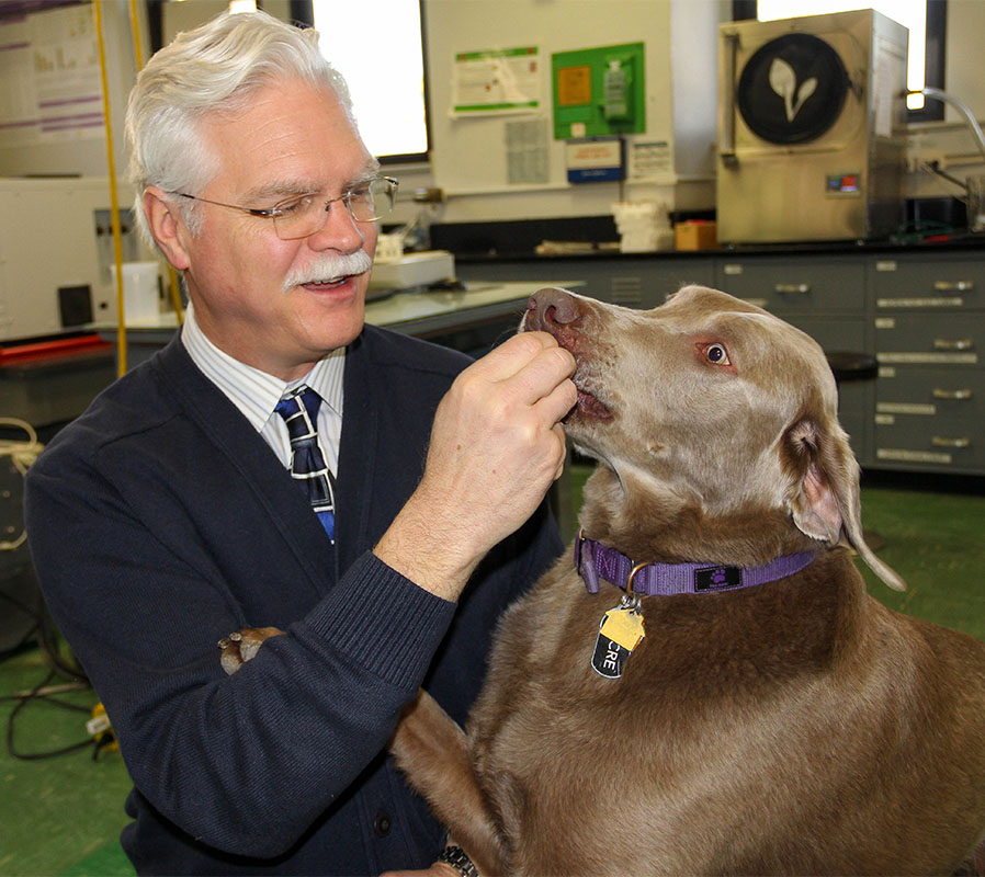 Greg Aldrich, Ph.D., research professor and Pet Food Program coordinator at Kansas State University, with his dog, Lucre. 