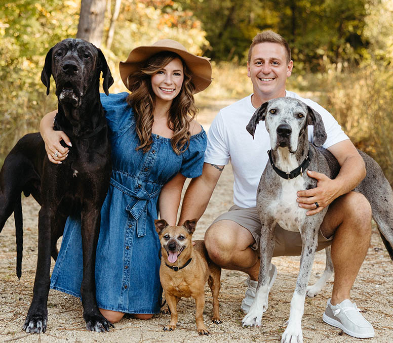 : The pups of the Opetz family — Duke, Bella, and Rousey — with Danielle and her husband, Kodie. 