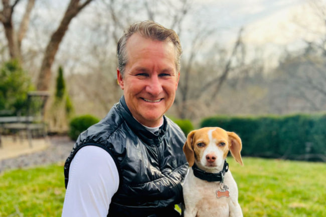 Roger Lund, senior vice president of international at Nulo, and his dog Ginger