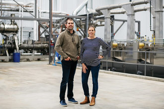 Co-directors and siblings, Sarah Barrett Reiner (right) and Tom Barrett (left), currently employ 250 people between the two BPI processing facilities in rural Minnesota.