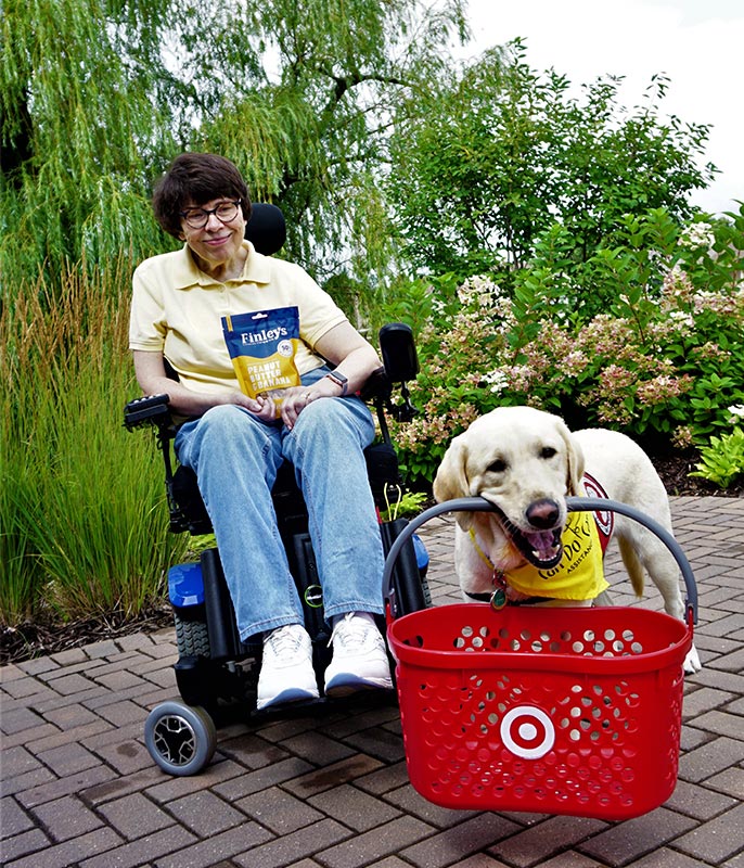 Finley's representative with dog holding Target shopping basket