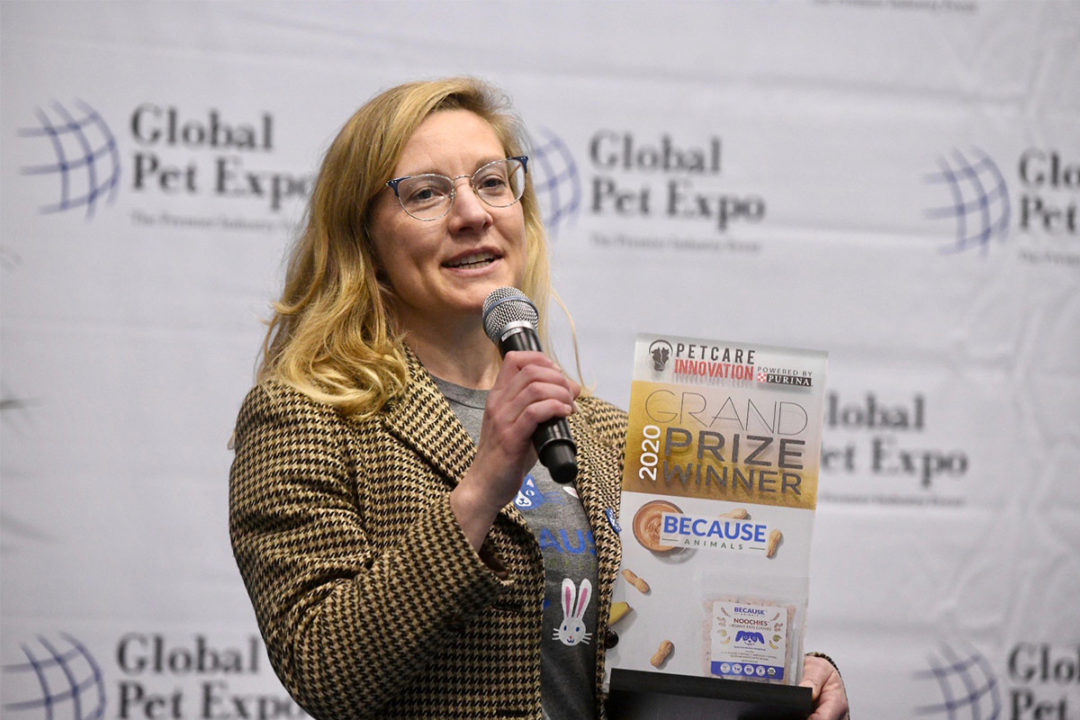 Shannon Falconer, CEO of Because Animals, accepts the grand prize from Purina's Pet Care Innovation program