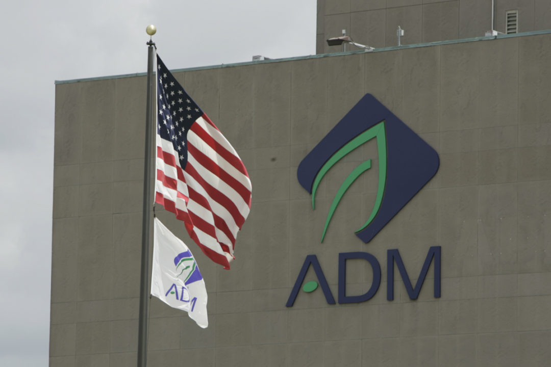 ADM building with logo and flags